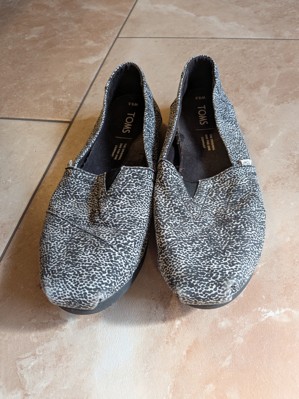 TOMS Women's Black and White Speckled Slip-On Flats